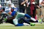 Dallas tight-end Jason Witten is downed by Seattle safety Kam Chancellor in the first quarter after 21-yard completion.