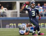 Seahawks' quarterback Russell Wilson tosses the ball away under pressure.