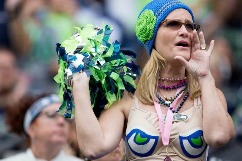 A fan with a particularly peculiar outfit watches the third quarter.