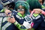 Seattle fans embrace after Sunday's 30-23 loss to the Dallas Cowboys.