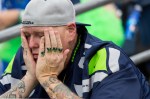 A Seattle fan reacts to Sunday's 30-23 loss to the Dallas Cowboys.