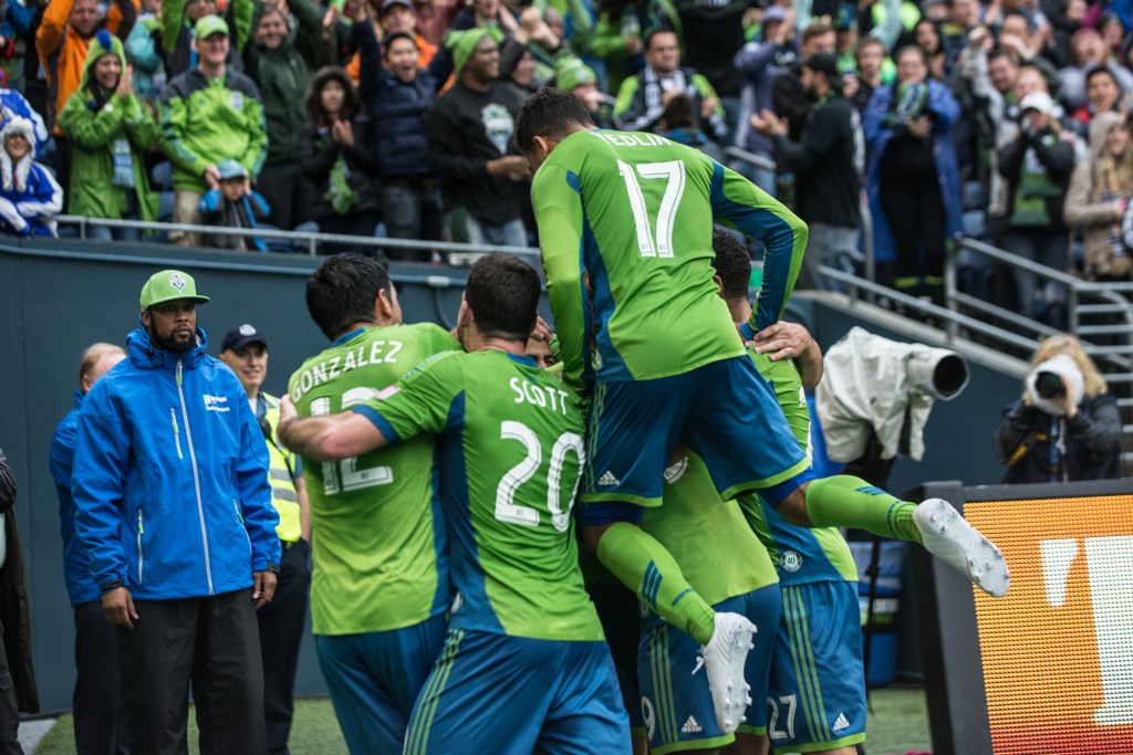 His Sounders teammates jump Pappa after his goal in the eighty-fourth minute. Photo by Morgen Schuler