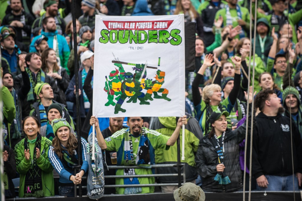 The fans stayed long after the game ended, cheering on their team. Photo by Morgen Schuler
