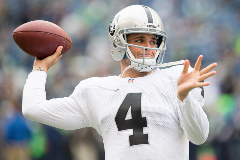 Raiders starting quarterback Derek Carr throws a pass during pre-game practice.