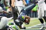 Seahawks' running back Marshawn Lynch tumbles into the end-zone for a touchdown in the first quarter.