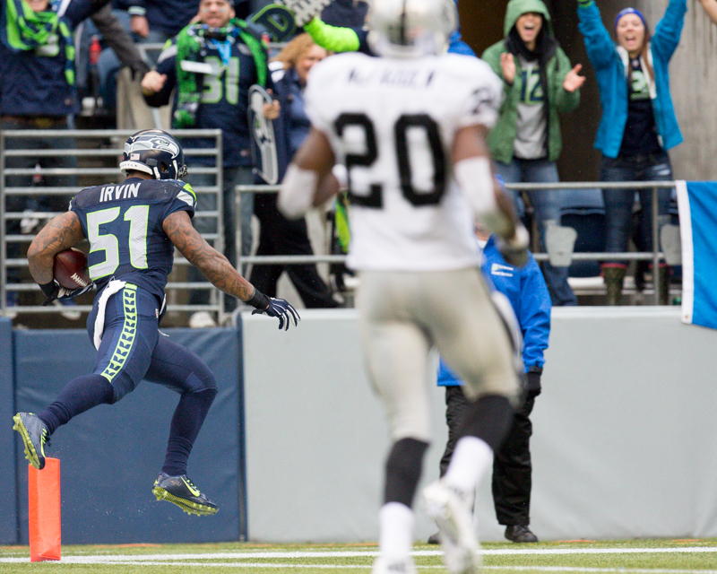 Seattle linebacker Bruce Irvin returns an interception 35 yards for a touchdown at the end of the first quarter.