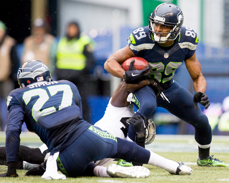 Hawk's receiver Doug Baldwin struggles to gain turf on a 20-yard catch in the second quarter.