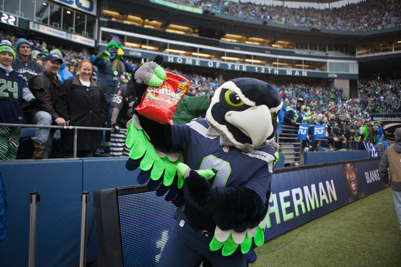 Seahawks' mascot Blitz holds up a bag of Skittles after running back Marshawn Lynch, who shares his nickname with the candy, scores a touchdown in the second quarter.