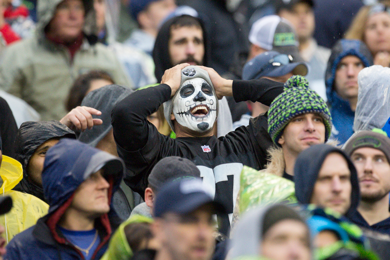 A Raiders fan reacts to the a missed pass to the end zone in the third quarter.