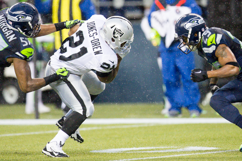 Raider running back Maurice Jones-Drew prepares for a hit by Seattle's Earl Thomas in the fourth quarter.