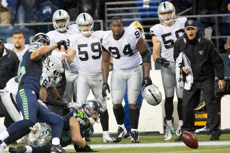 A loose ball rolls out of the hands of Seattle's Cooper Helfet after an onside kicker by Oakland with under two minutes in the fourth quarter.