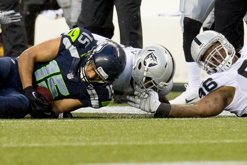 Seattle's Jermaine Kearse recovers an Oakland onside kick to end the game, 30-24.