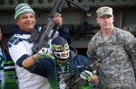 Seahawks fans poses with members of the 2-1 2nd Brigade based at JBLM before the Seahawks game on November 9, 2014.