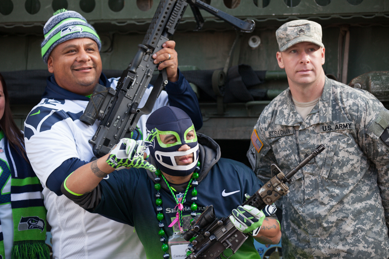 Seahawks fans poses with members of the 2-1 2nd Brigade based at JBLM before the Seahawks game on November 9, 2014.