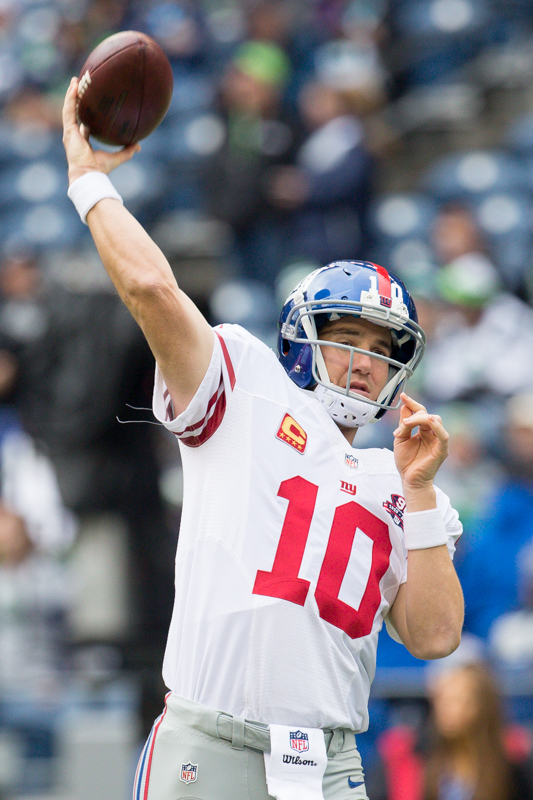 NY Giants starting quarterback Eli Manning throws in warm-up practice.