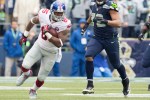 Giants tight-tend Daniel Fells runs up the field after a short pass and a 12-yard gain in the first quarter.