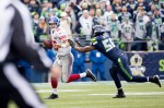 Giants quarterback Eli Manning is pressured by defensive end Cliff Avril into throwing an incomplete pass in the first quarter.