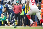 Seattle running back Marshawn Lynch runs upfield after catching a 23-yard pass in the first quarter.