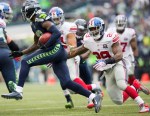 Seattle receiver Paul Richardson is chased down by Giants' defenders on a kick off in the first quarter.