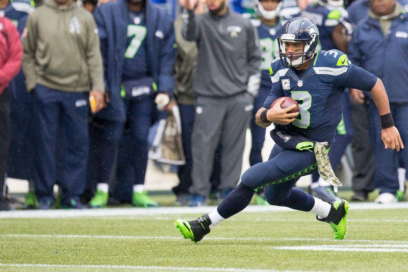 Seattle quaterback Russell Wilson scrambles for a gain in the first quarter.