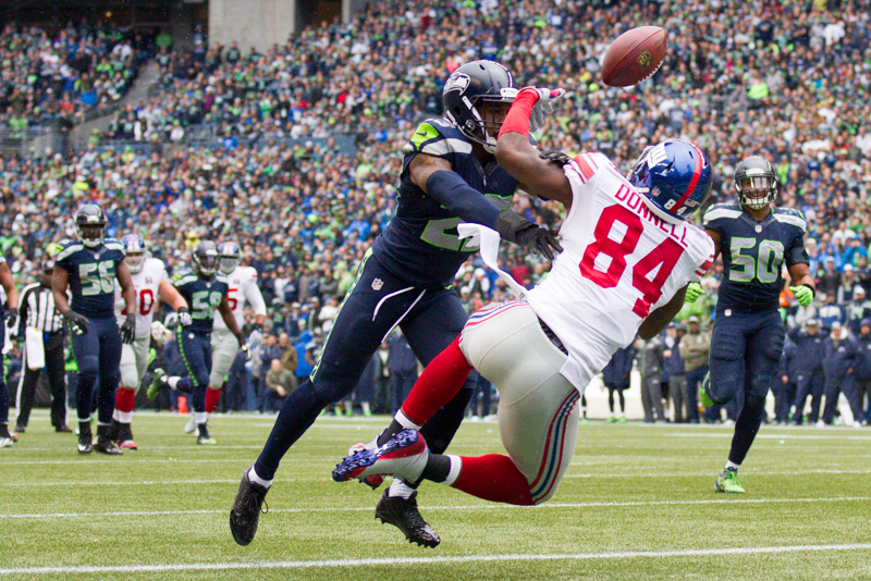 Giants tight end Larry Donnell is denied a touch-down by Seattle safety Jeron Johnson in the first quarter.