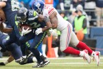 Seahawks running back Robert Turbin is tackled by Giants defensive end Robert Ayers JR for a gain of five in the first quarter.