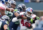 Giants running back Andre Williams is tackled for a 7-yard run in the second quarter.