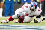 Giants running back Andrea Williams rolls into the end-zone on a three-yard run in the second quarter.
