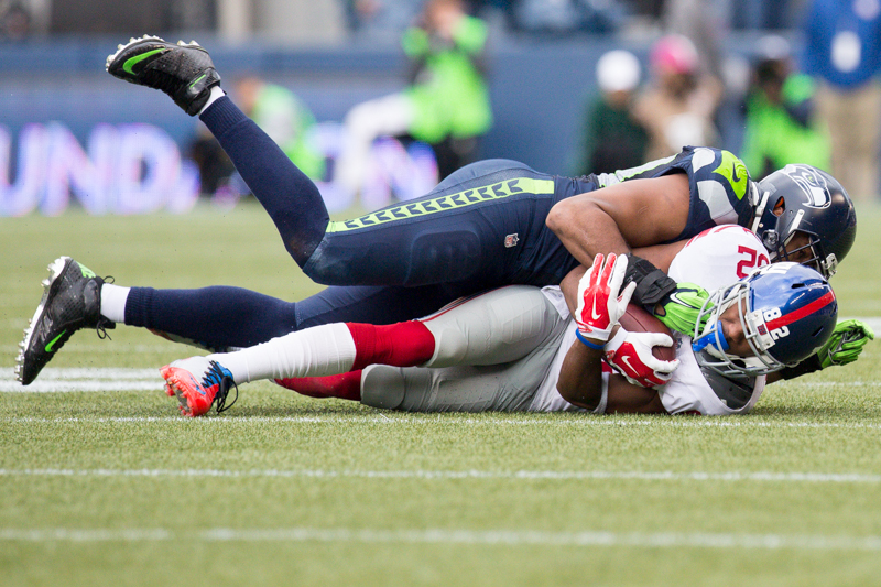 Giants receiver Rueben Randle is downed for 3 yards by Seattle linebacker KH Wright in the second quarter.