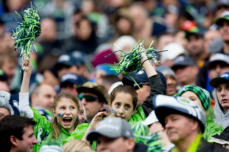 Girls cheer on the Seahawks in the second quarter.