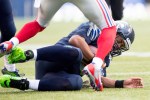 Seahawks quarterback Russell Wilson is downed after a scramble in the third quarter.