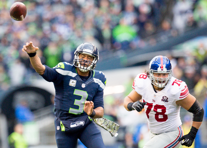 Russell Wilson throws a pass in the third quarter.