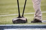 Skittles are cleaned off the field after a Lynch touchdown in the second quarter.