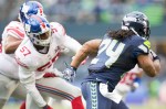 Hawks running back Marshawn Lynch is chased down for a 22-yard run in the third quarter.
