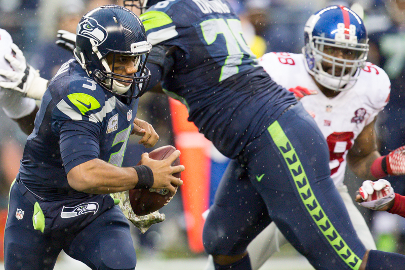 Russell Wilson scrambles out of the pocket before popping off an incomplete pass in the third quarter.