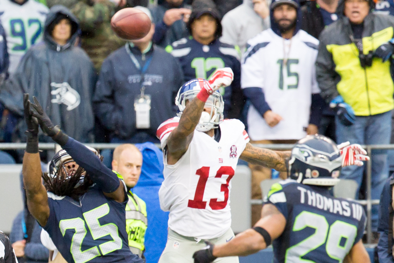 Seattle cornerback Richard Sherman tips a deep pass intended for Giants Odell Beckham to Seattle safety Earl Thomas in the third quarter.