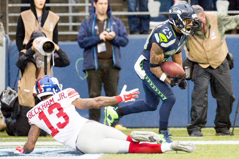 Hawks' safety Earl Thomas breaks away after intercepting a Manning pass in the end zone, running it back for a 47-yard run in the third quarter.