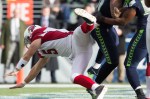 Cardinals quarterback Drew Stanton takes a hard fall after popping a short pass in the first quarter.