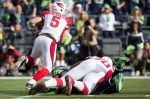 Cardinals quarterback Drew Stanton scrambles to avoid a Seattle rush in the first quarter.