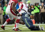Arizona quarterback Drew Stanton is sacked for a 7-yard loss by Seattle's Cliff Avril in the second quarter.
