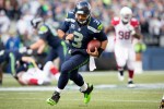 Hawks quarterback Russell Wilson rushes for a 40-yard gain in the second quarter.