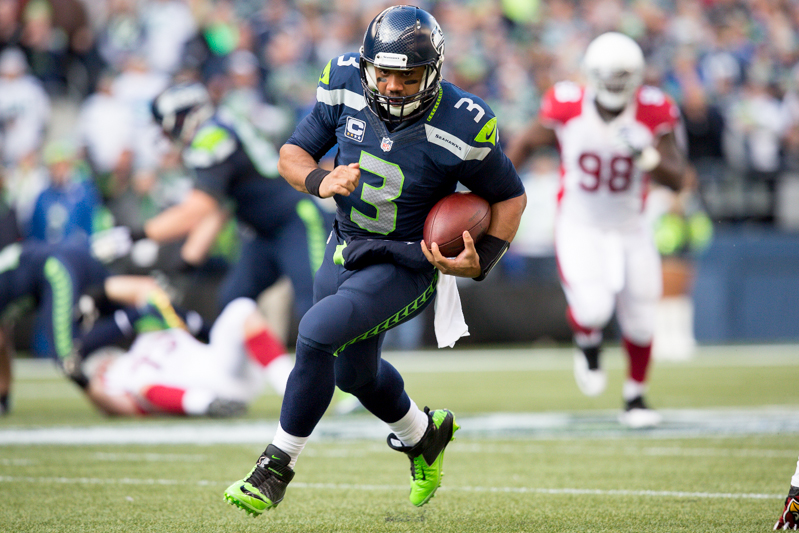 Hawks quarterback Russell Wilson rushes for a 40-yard gain in the second quarter.