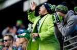 Seattle fans cheer on the team as Arizona faces third and goal in the second quarter.