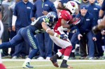 Arizona's Andre Ellington is quickly taken down by Earl Thomas for a one-yard gain in the third quarter.