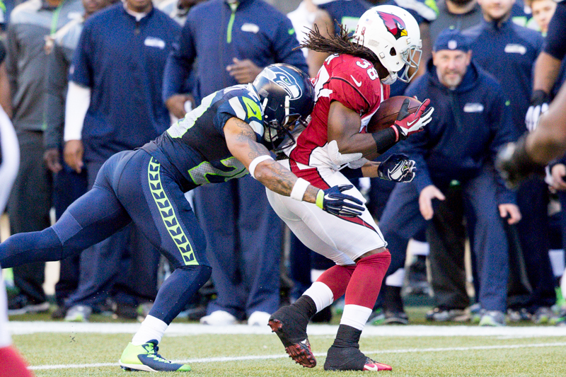Arizona's Andre Ellington is quickly taken down by Earl Thomas for a one-yard gain in the third quarter.