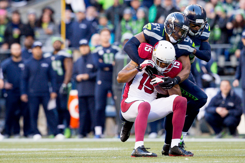 Arizona receiver Michael Floyd is tackled by Seattle's Bobby Wagner for a 11-yard gain in the third.