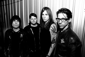 Against Me!'s Laura Jane Grace, third in from left.