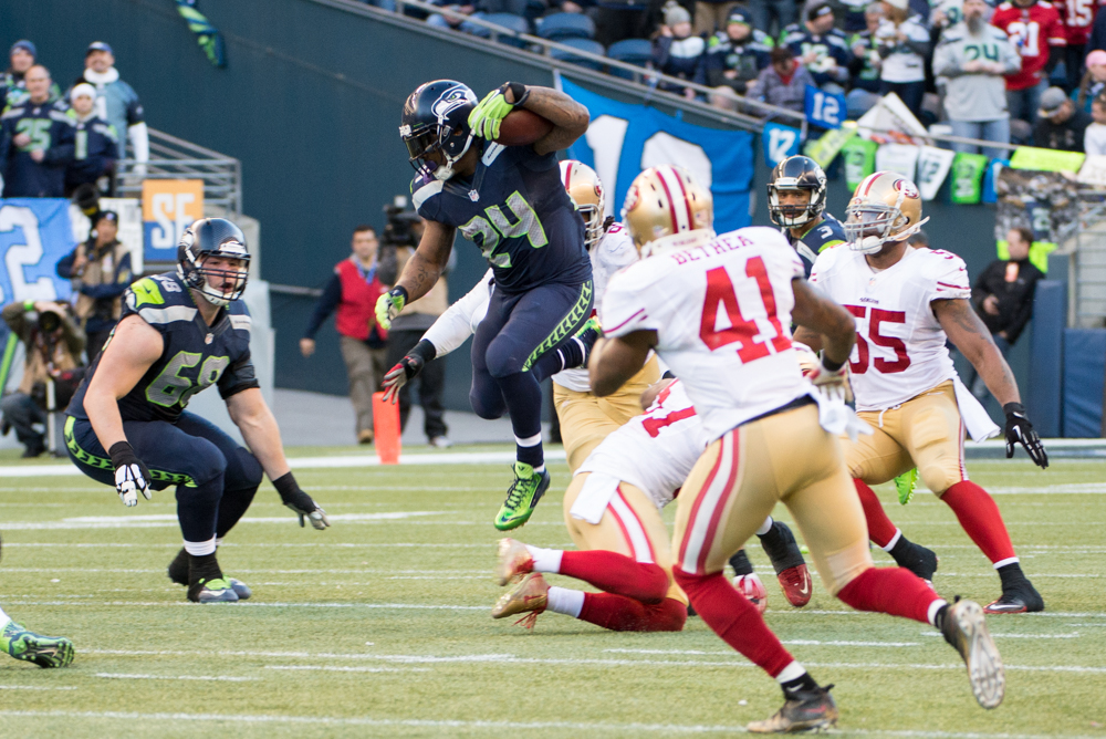 Marshawn Lynch making a graceful leap for a six-yard gain before McDonald took him down.