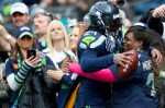 Seahawks' running back Marshawn Lynch gives his mother a hug before the team faces off against the St. Louis Rams.
