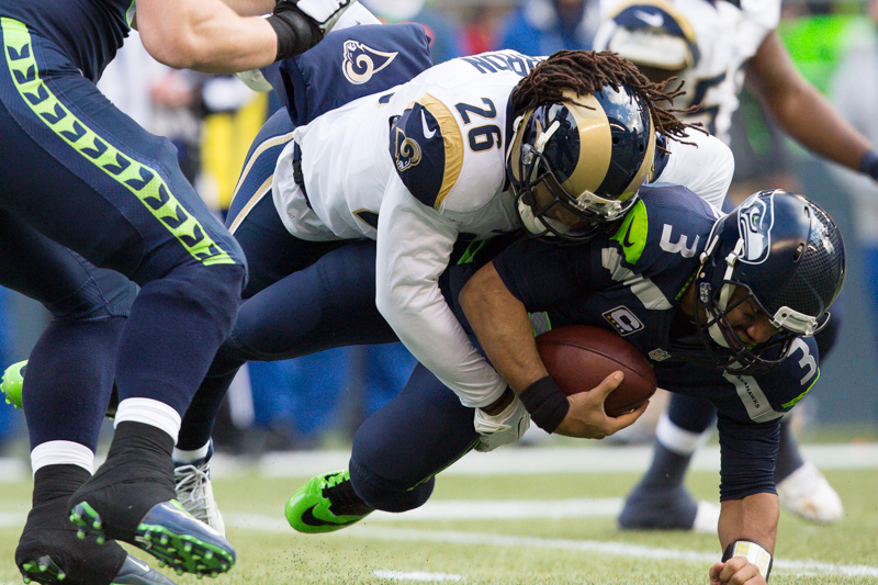 Russell Wilson is sacked by Rams' safety Mark Barron in the first quarter.